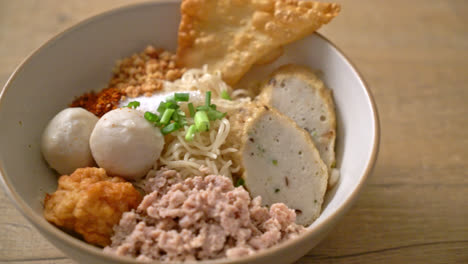 spicy egg noodles with fish balls and shrimp balls without soup - asian food style