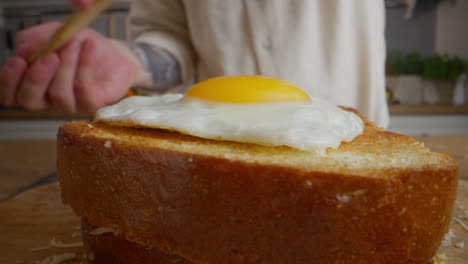 preparing a delicious toast sandwich with fried egg