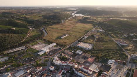 panoramic view green fields surrounding silves, algarve. beautiful sunset light