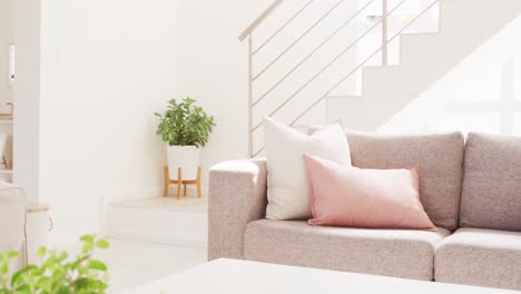 general view of living room interior with sofa and stairs