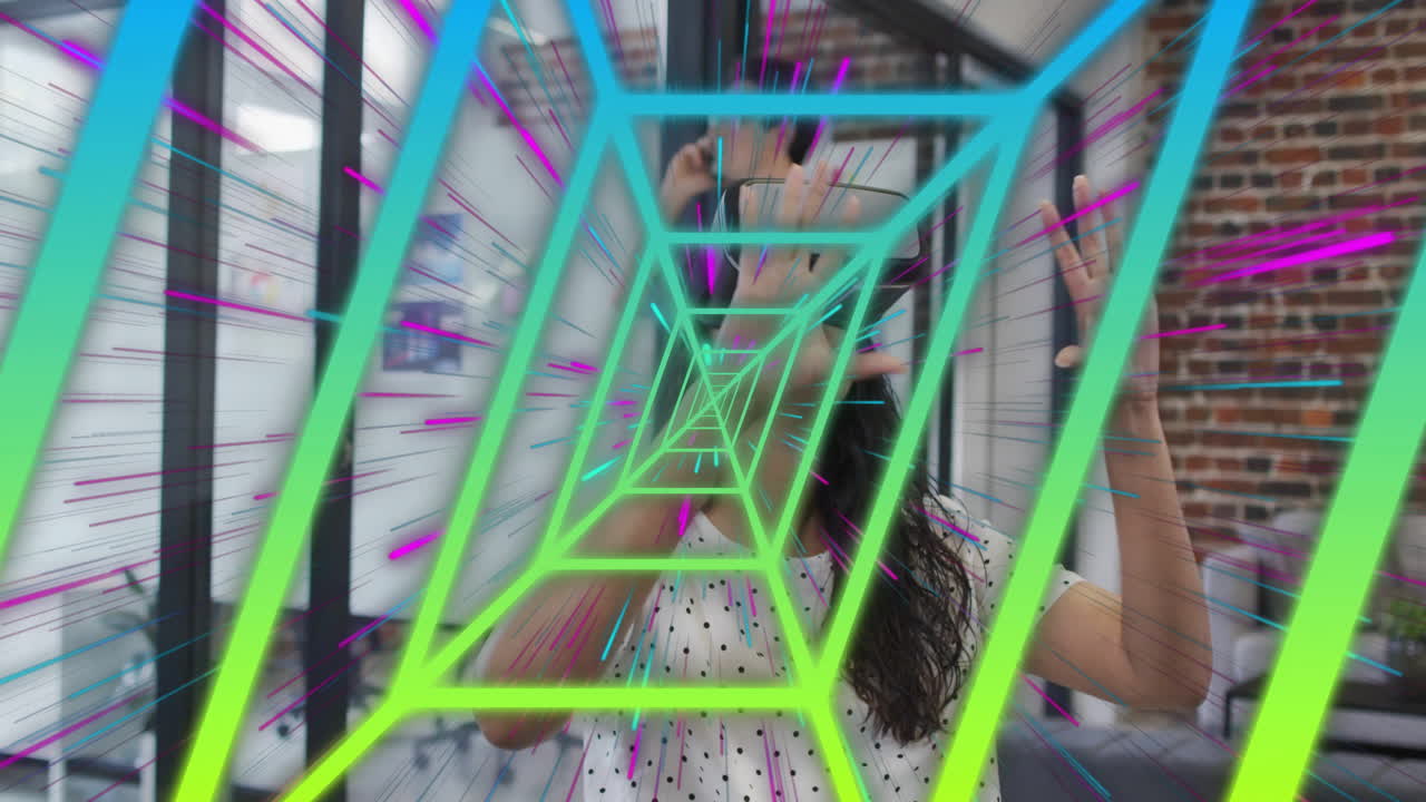 Colorful geometric tunnel animation over person with raised hands in modern space