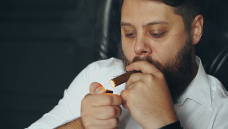 man smoking cigar. elegantly dressed man smoking cigar in studio