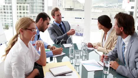 animation of heart day over caucasian businesspeople working in office