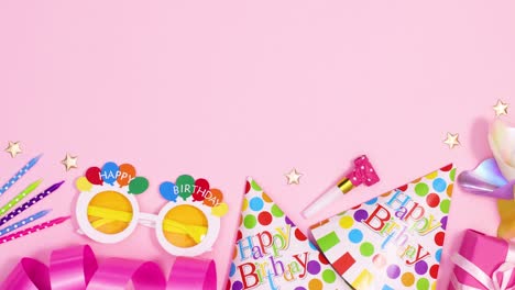 party decorations and accessories move on bottom of pastel pink theme. stop motion