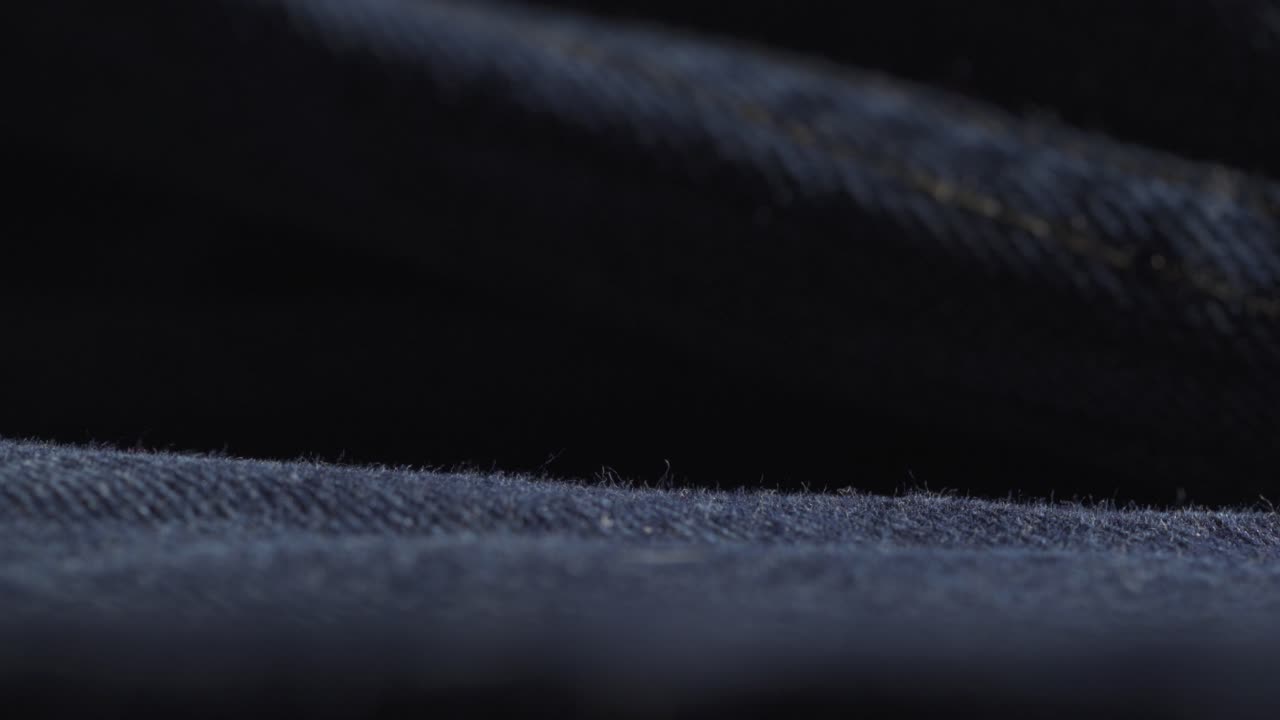 fotografía macro de textiles de ropa de jeans de mezclilla, material de tela azul índigo