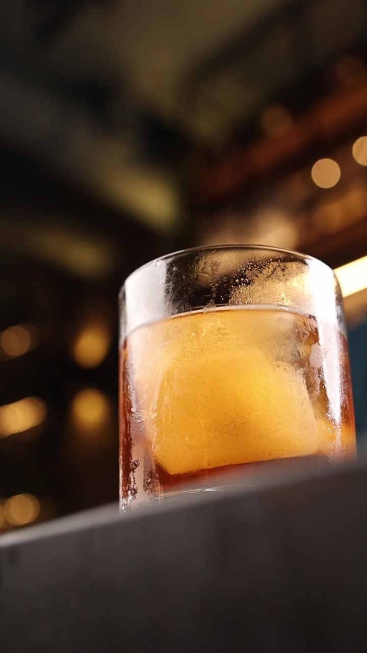 Cocktail with large ice cube