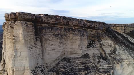 dramatic cliff face in a dry landscape