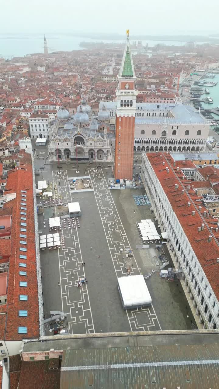 Piazza San Marco in Venice, Italy iconic St. Mark's Campanile and Basilica, aerial drone video