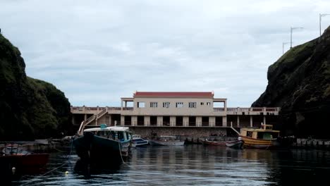 Boats-docked-on-a-famous-harbour-in-Batanes,-Philippines