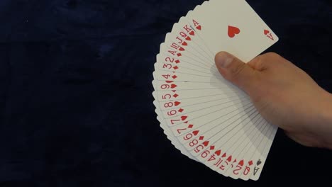 right handed playing card fan of hearts