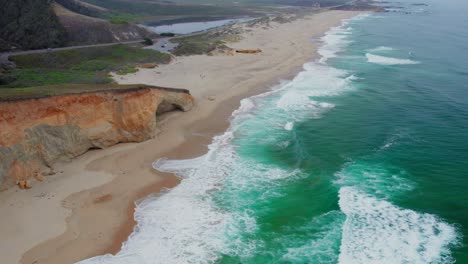 aerial view drone shot of birds flying over the pacific ocean