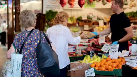 people buying fruits and vegetables