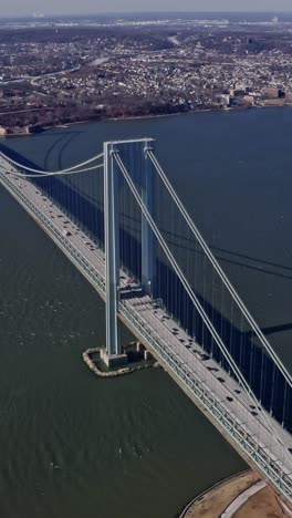 verrazano narrows bridge with passing cars and trucks