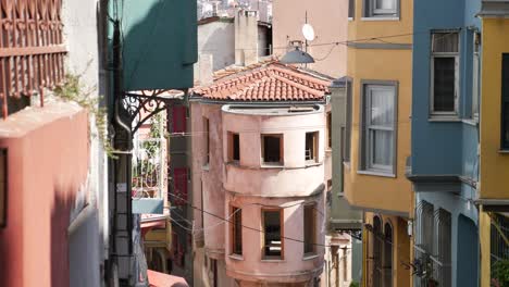 a narrow street in a city with old colorful buildings