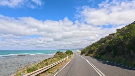 a 14-second video capturing a drive along the great ocean road, showcasing coastal views, lush greenery, and clear skies