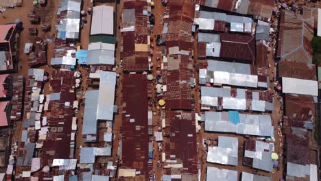 aerial smooth top down view showing dense rooftops of karshi vibrant market zone