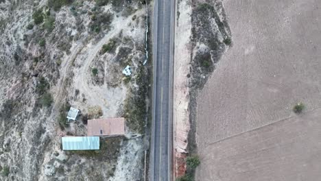 Flying-view-of-a-red-car-passing-by