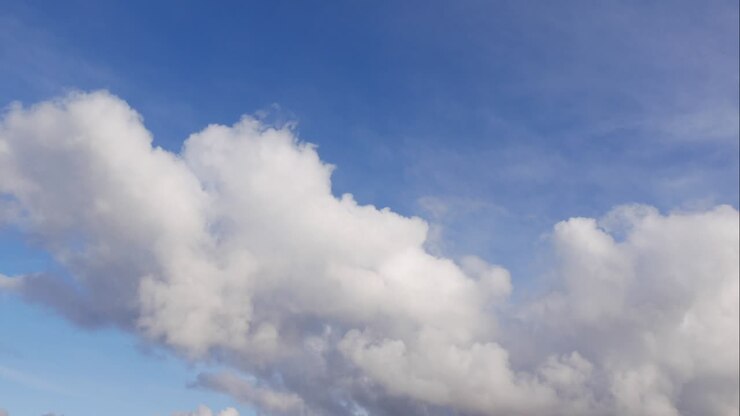 Blue sky white clouds. Puffy fluffy white clouds. Cumulus cloud scape timelapse. Summer blue sky time lapse. Dramatic majestic amazing blue sky. Soft white clouds form. Clouds time lapse background