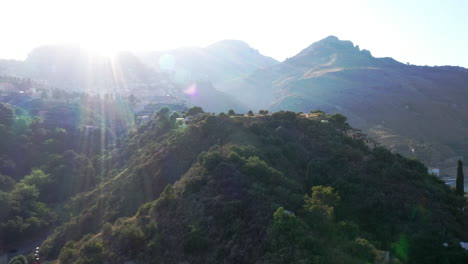 beautiful aerial shot with sunset over green mountains