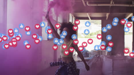 woman raising purple smoke flare inside warehouse, showing social media ads with floating reactions