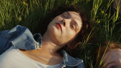 friends relaxing in a field