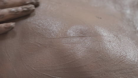 Close-Up-of-Body-Scrub-and-Mud-Wrap-Therapy,-Female-Hands-Mud-Wrap-Skin-Treatment,-Gentle-Body-Scrub-for-Soft-Skin