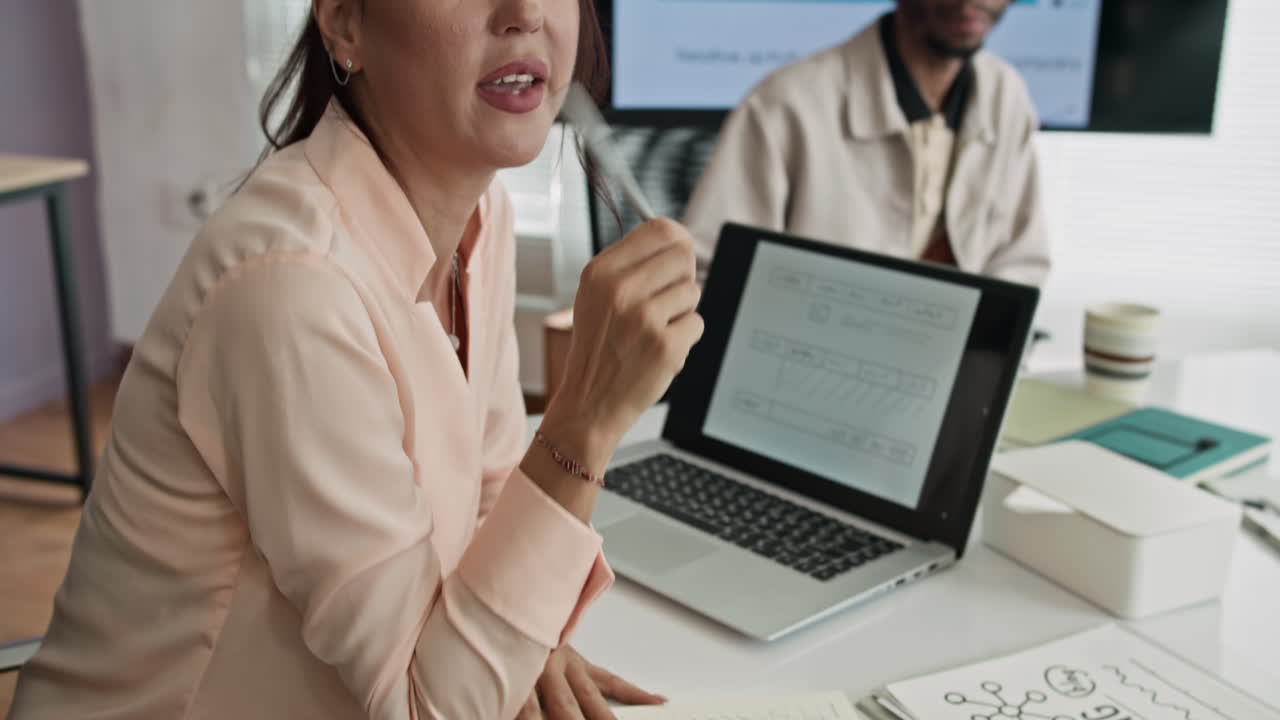 Female Manager Meeting with Colleagues at Office