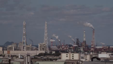 japanese industry and chimney smoke stacks factory in industrial park in kokura, japan, asia