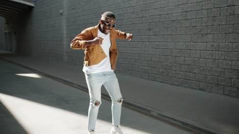 stylish man dancing on the street