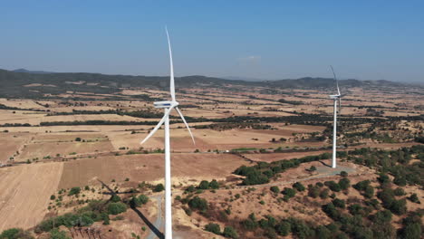 aerial view of wind turbines in a rural landscape
