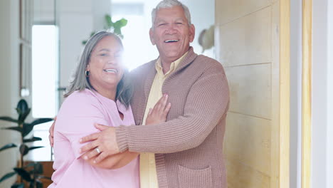 senior couple, happy and smiling at door