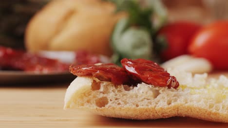 dried tomatoes close up, italian restaurant with traditional food, spanish cuisine, delicious tapas and white wine, bruschetta with cheese, olives dry tomatoes and tasty sandwich bar appetizer, buffet