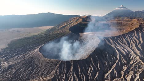 spectacular aerial view of bromo volcano craters and cone shaped semeru on horizon. east java
