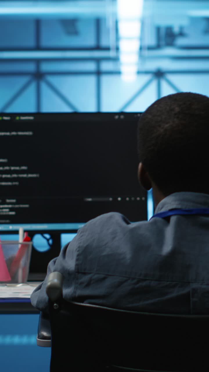 Programmer Working on Code in a Modern Tech Office