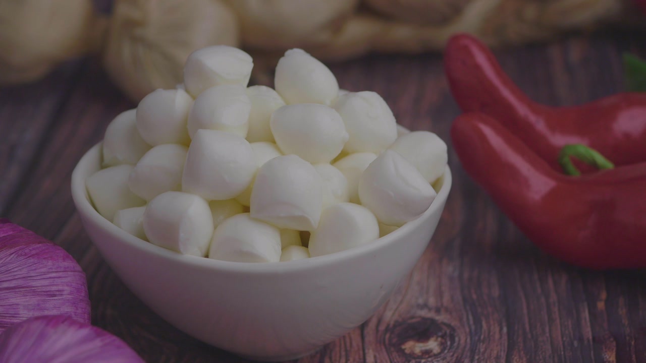 Fresh Mini Mozzarella Balls in a White Bowl