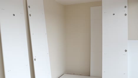 building a new white closet in a bedroom