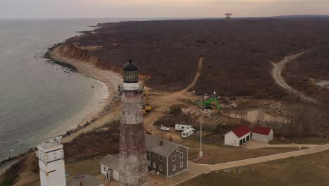 an aerial view of the montauk lighthouse at sunset