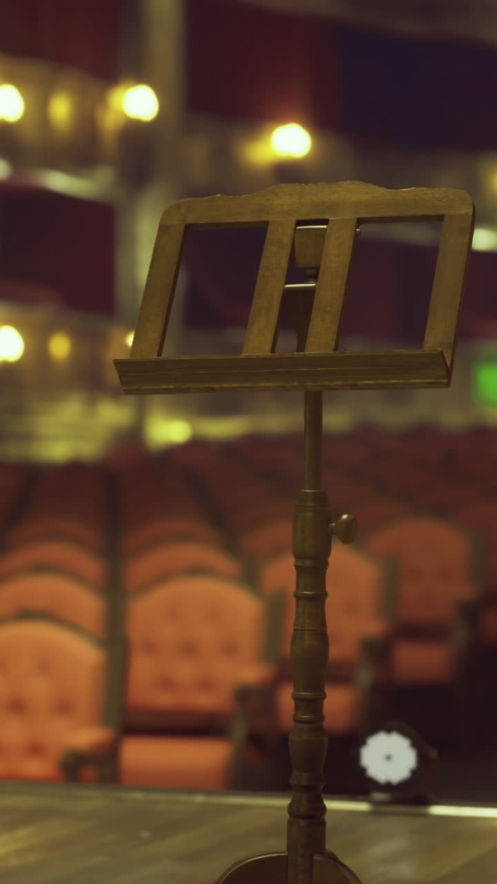 Empty theater with music stand ready for performance before audience arrival