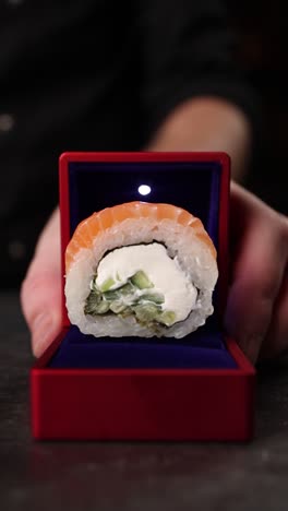sushi roll presented in a ring box