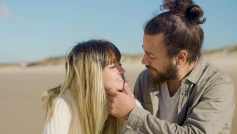 Young-married-couple-spending-time-outside-at-the-beach