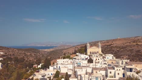 aerial drone shot over the village of lefkes greece punching in to reveal the landscape of the island