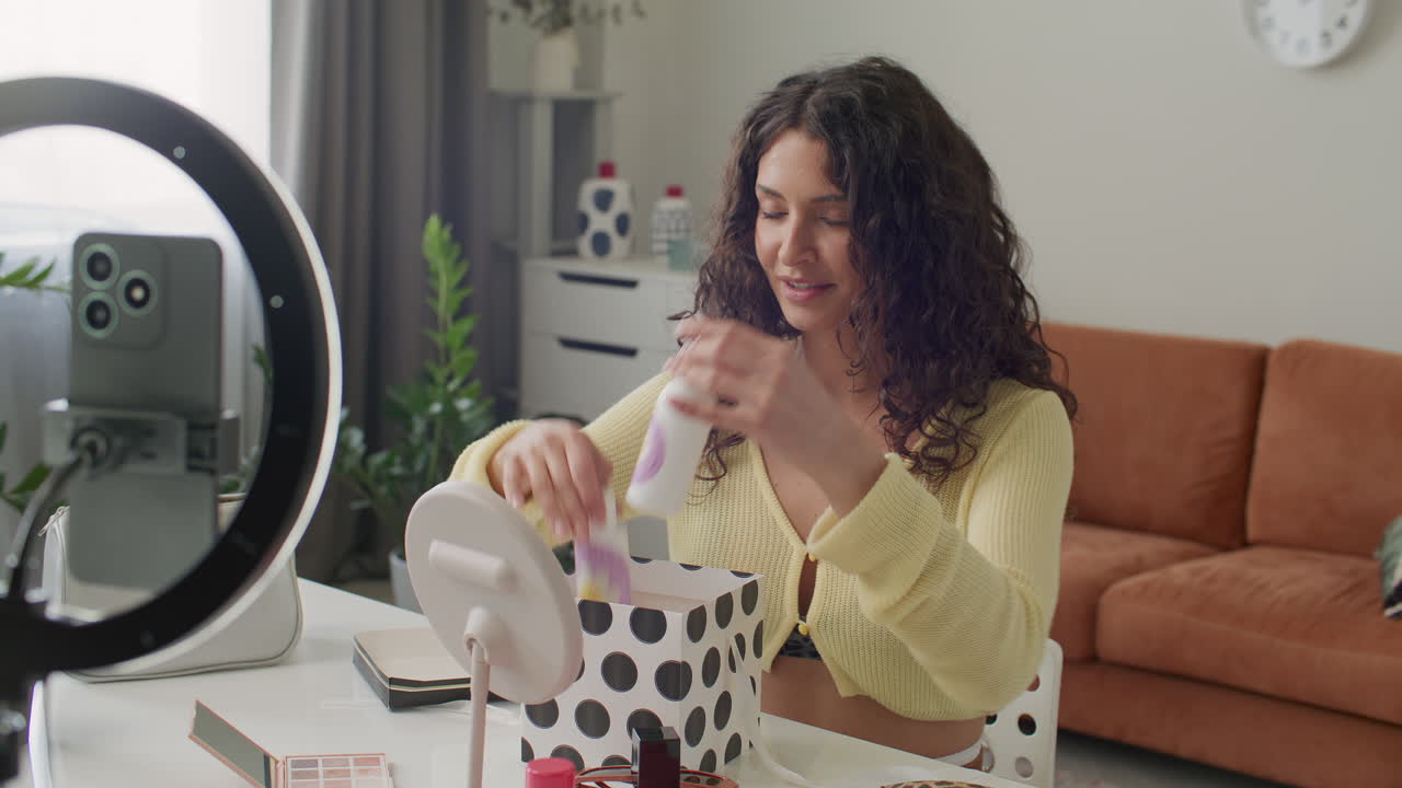 Young Woman Applying Face Mist as Recording Beauty Content at Home