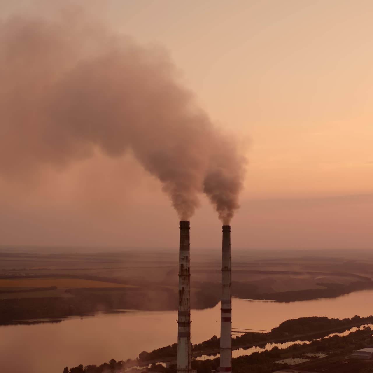 Factory construction engineering. Industry factory gas tubes on sunset