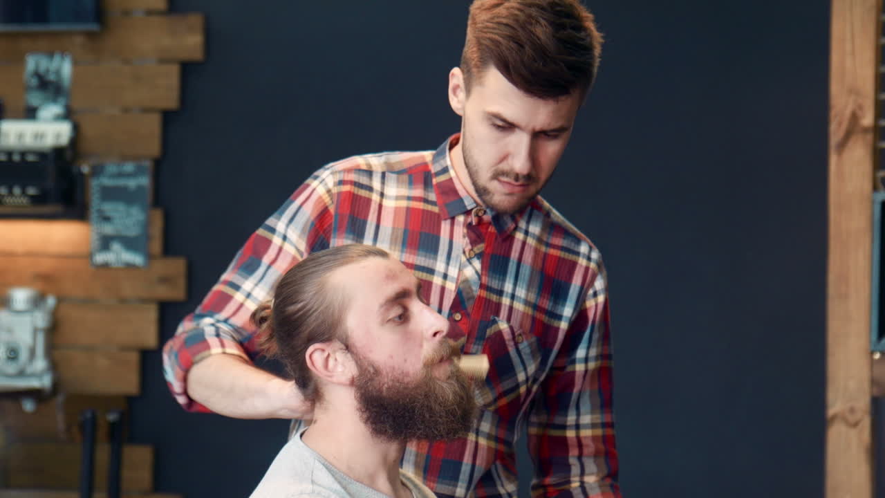 Barber Giving a Haircut to a Client