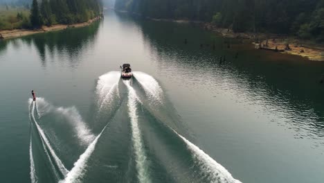 man wakeboarding with motorboat in the river 4k