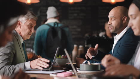 businessmen shaking hands in coffee shop enjoying successful business deal partnership