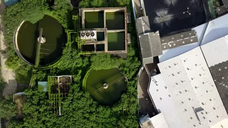aerial top view 4k of waste water treatment system in industrial estate