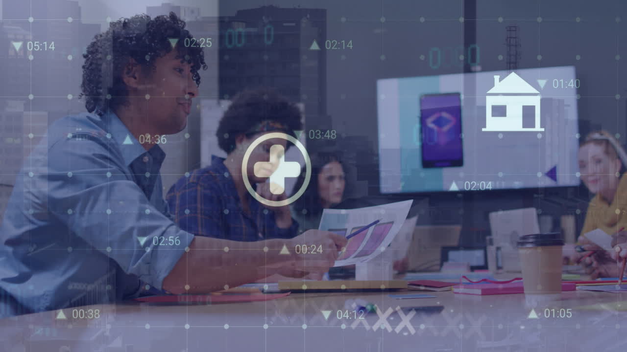 Animation of multiple digital icons over biracial man discussing with diverse colleagues at office