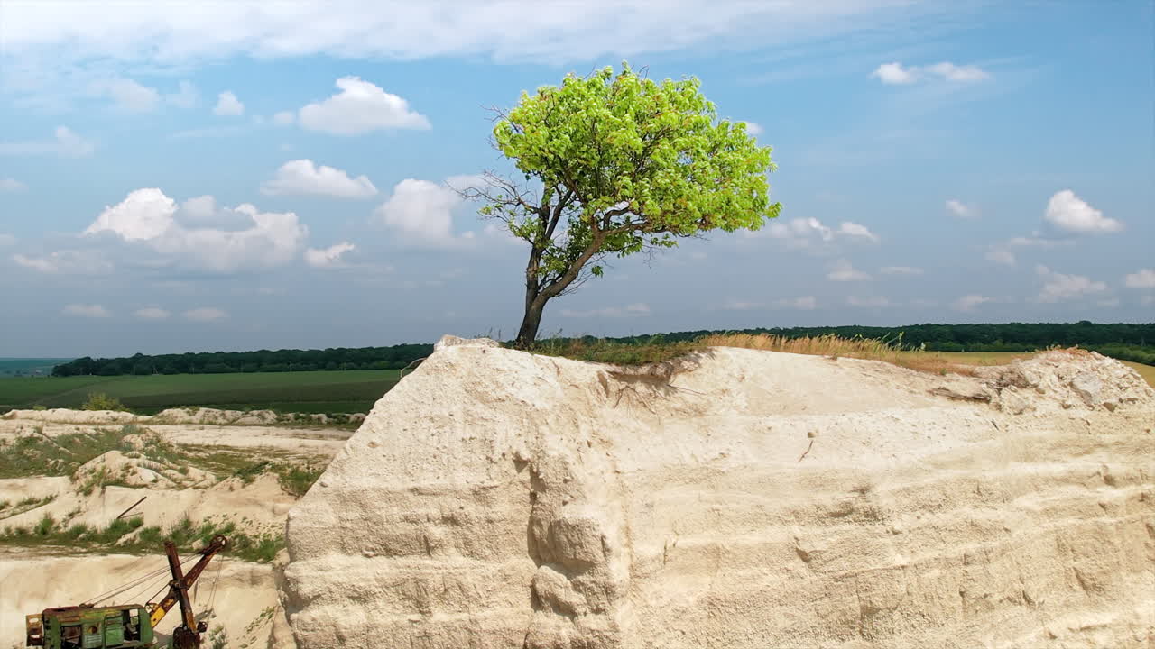 Aerial drone view of the Little Switzerland of Moldova located in Fetesti. Former limestone quarry with unusual landforms. lonely tree on top of a rock