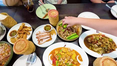 group enjoying traditional isan dishes together